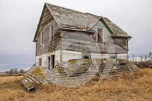 Abandoned farm house on prairie