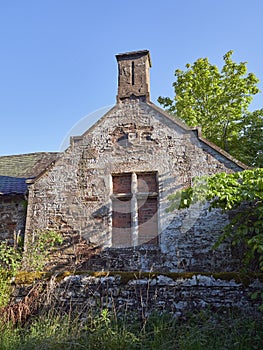 An Abandoned Farm Steading near Guthrie Castle has its windows bricked up to prevent access.