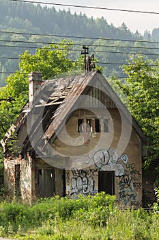 Abandoned farmhouse in Zilina, Slovakia under the trees