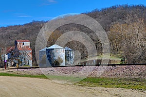 Abandoned Feed Mill Along Railroad Tracks photo