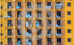 An abandoned flat building in Malaga, containing mattresses, tables and chairs.