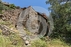 Abandoned flour mill among the trees