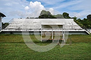 Abandoned football stadium and field with nobody