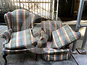 Abandoned furniture on city sidewalk photo