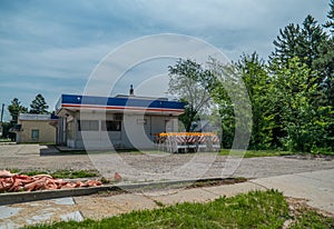 Abandoned gas station and barricades