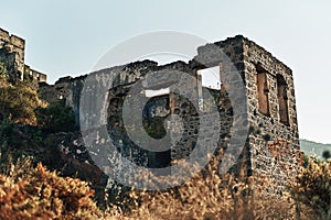 The abandoned Greek village of Kayakoy, Fethiye, Turkey. Ghost Town Kayakoy. Turkey, evening sun. Ancient abandoned