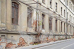 Abandoned grunge building with with boarded up windows