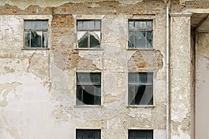 Abandoned grunge cracked stucco wall