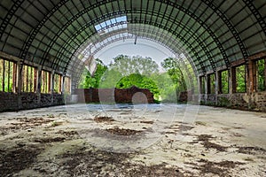 Abandoned hangar in forest