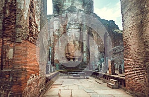 Abandoned historical statue of standing Buddha without head. UNESCO world heritage site of Polonnaruwa, Sri Lanka