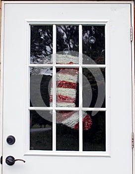 Abandoned Home with Christmas Stocking in Door Window