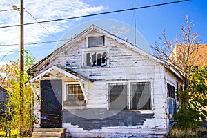 Abandoned Home In Disrepair With Barred Windows