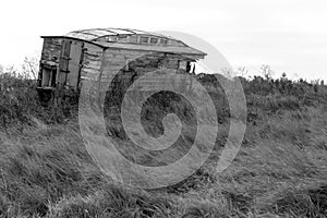 Abandoned horse box in monochrome