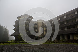 Abandoned hotel on a foggy day