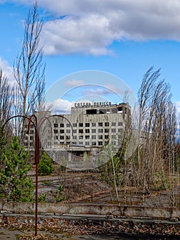 An abandoned hotel, Hotel Polissya, in a desolate area with bare trees