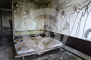 an abandoned hotel room after a raid by vandals