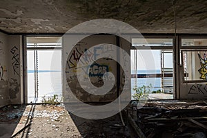 an abandoned hotel room after a raid by vandals