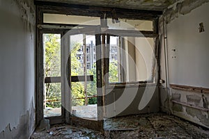 an abandoned hotel room after a raid by vandals