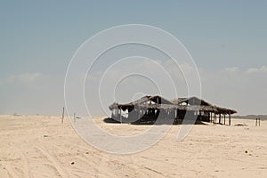 Abandoned house on the beach photo