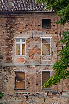 Abandoned house with brick facades and closed windows. Casalmaggiore, Lombardia, Italia photo