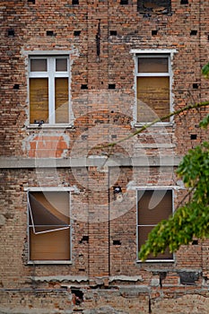 Abandoned house with brick facades and closed windows. Casalmaggiore, Lombardia, Italia photo