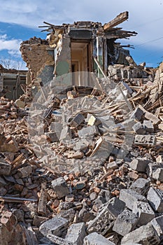 An abandoned house collapses. The house is destroyed. Cracks in wall of house. Destruction of old houses, earthquakes