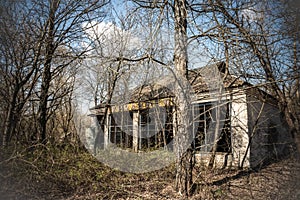 Abandoned house in destroyed village of Kopachi Chernobyl zone, Ukraine