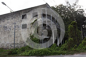 Abandoned house and old commercial building beside Ban Phe road in Rayong, Thailand