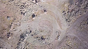 Abandoned house on rocky ground. Clip. Top view of abandoned house located on lifeless rocky terrain. Lonely abandoned