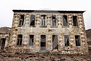 Abandoned house with stucco architraves