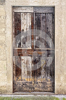 Abandoned house with wooden door.