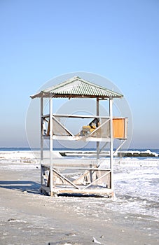 Abandoned, icy rescue station. Beach tower