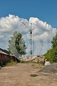 abandoned industrial area with construction crane
