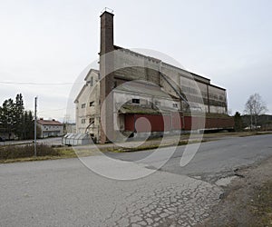 Abandoned industrial building with brick pipe