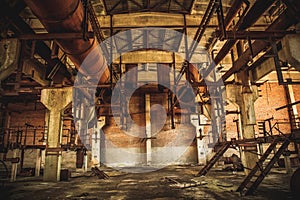 Abandoned industrial creepy warehouse inside old dark grunge factory building