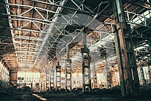 Abandoned industrial creepy warehouse inside old grunge factory building toned