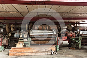 Abandoned industrial machines left in a decaying factory