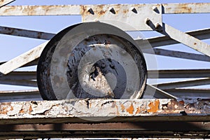 Abandoned industrial metal rusted wheel for cableway mining
