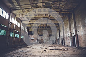 Abandoned industrial warehouse on ruined brick factory, creepy interior, perspective