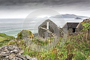Abandoned Irish Famine Farmhouse on Cliff photo