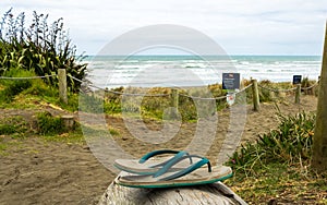 Abandoned Jandals at Muriwai Beach Aucland New Zealand photo