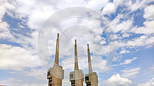 Abandoned and landmark three chimneys disused power station on the outskirts of Barcelona, Spain.