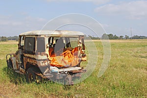 Abandoned landrover car wreck decays fields, Australia