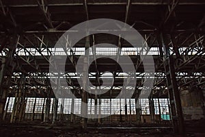 Abandoned large industrial hall or warehouse with garbage. Voronezh excavator factory