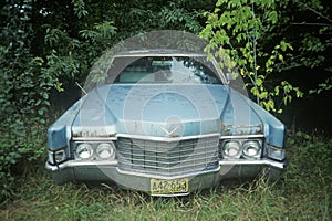 An abandoned light blue classic car in Wisconsin