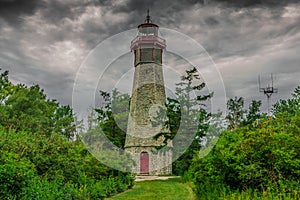 An abandoned lighthouse in a cloudy day