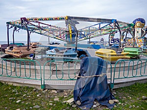 Abandoned Luna Park. A crisis. Old carousels. Does not work. Broken attraction. resort in winter. Broken business. Emptiness