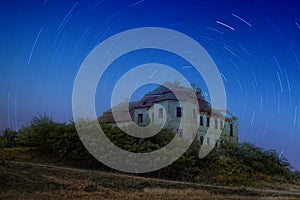 Abandoned mansion under the stars