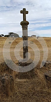 Abandoned medieval cross in the fields. Pelorinho