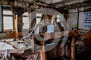 Abandoned, messy, old. creepy, collapsed room with windows covered in the building located in the Chernobyl ghost town